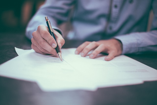 person signing documents for licensing