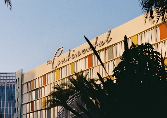 a retro hotel with palm trees