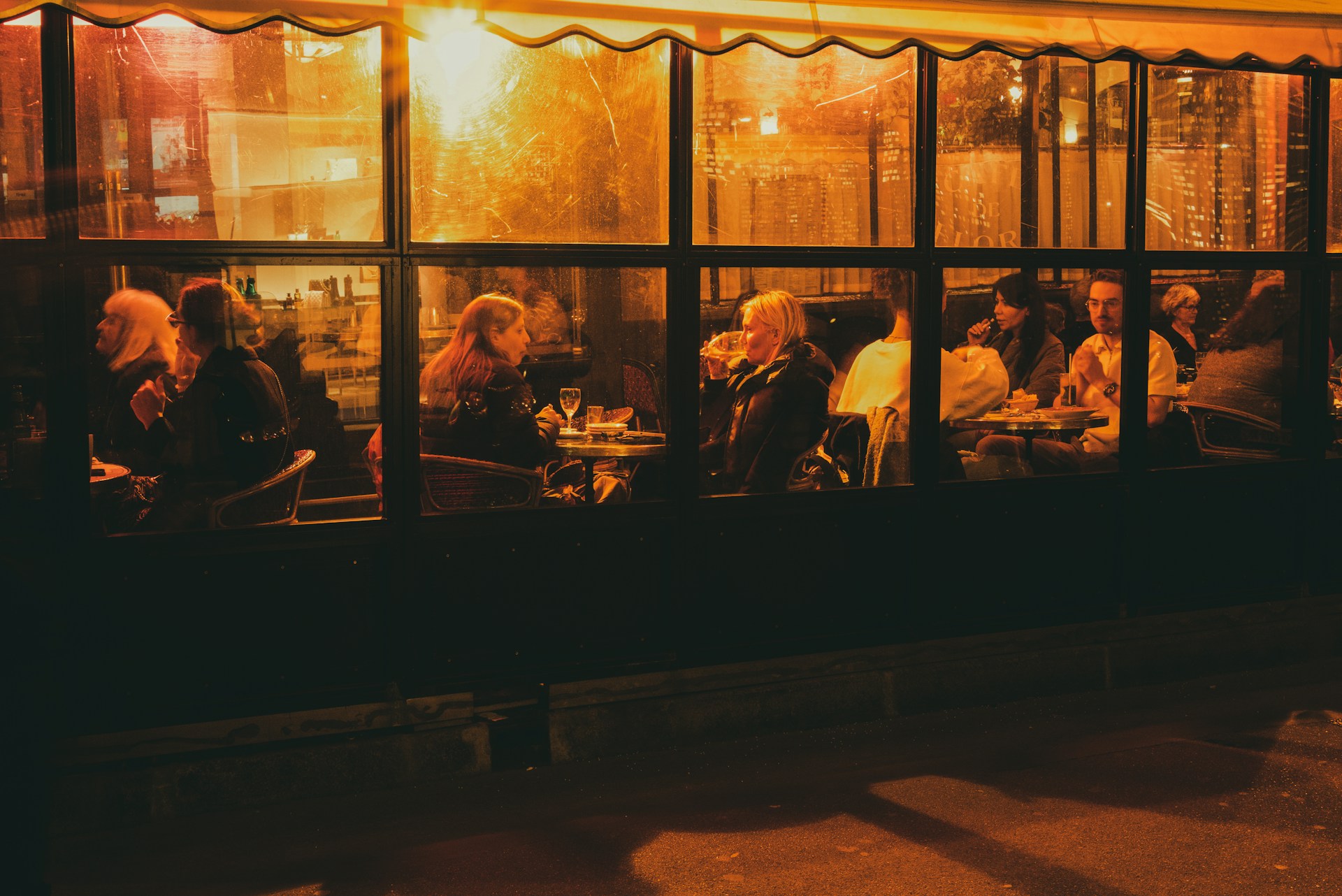 a look through the window of a busy restaurant