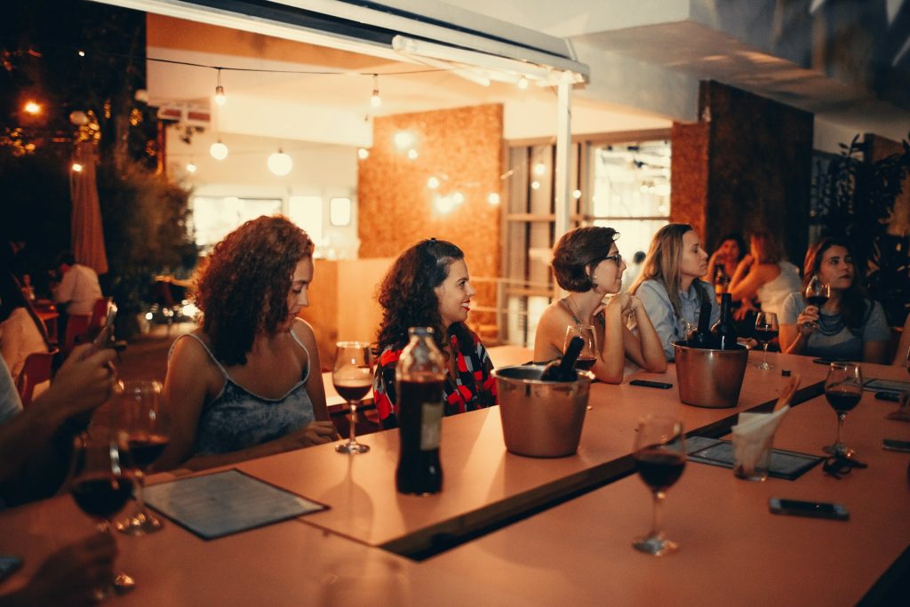 a group of people sat at a table in a restaurant