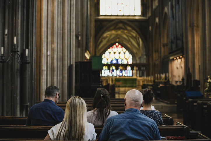 people sat down in the inside of a church