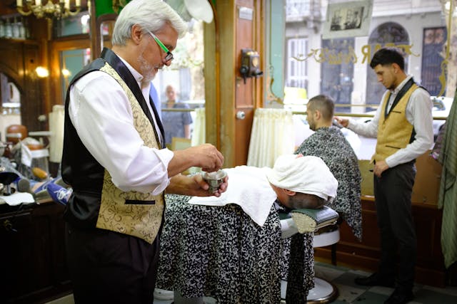 the inside of a busy barber shop