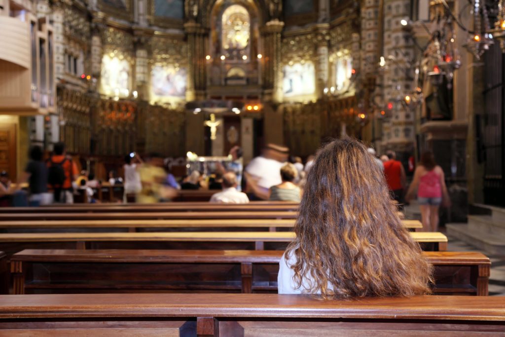 a lady in church praying