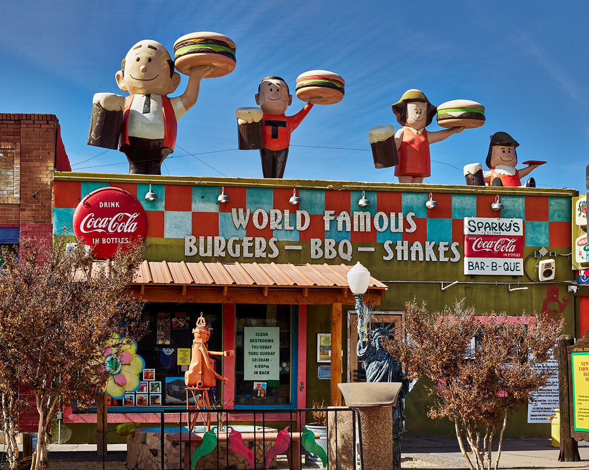 Photo of a restaurant with a sign reading 'World famous Burguers - BBQ - Shakes'